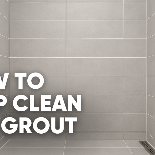 A modern shower tiled from floor to ceiling