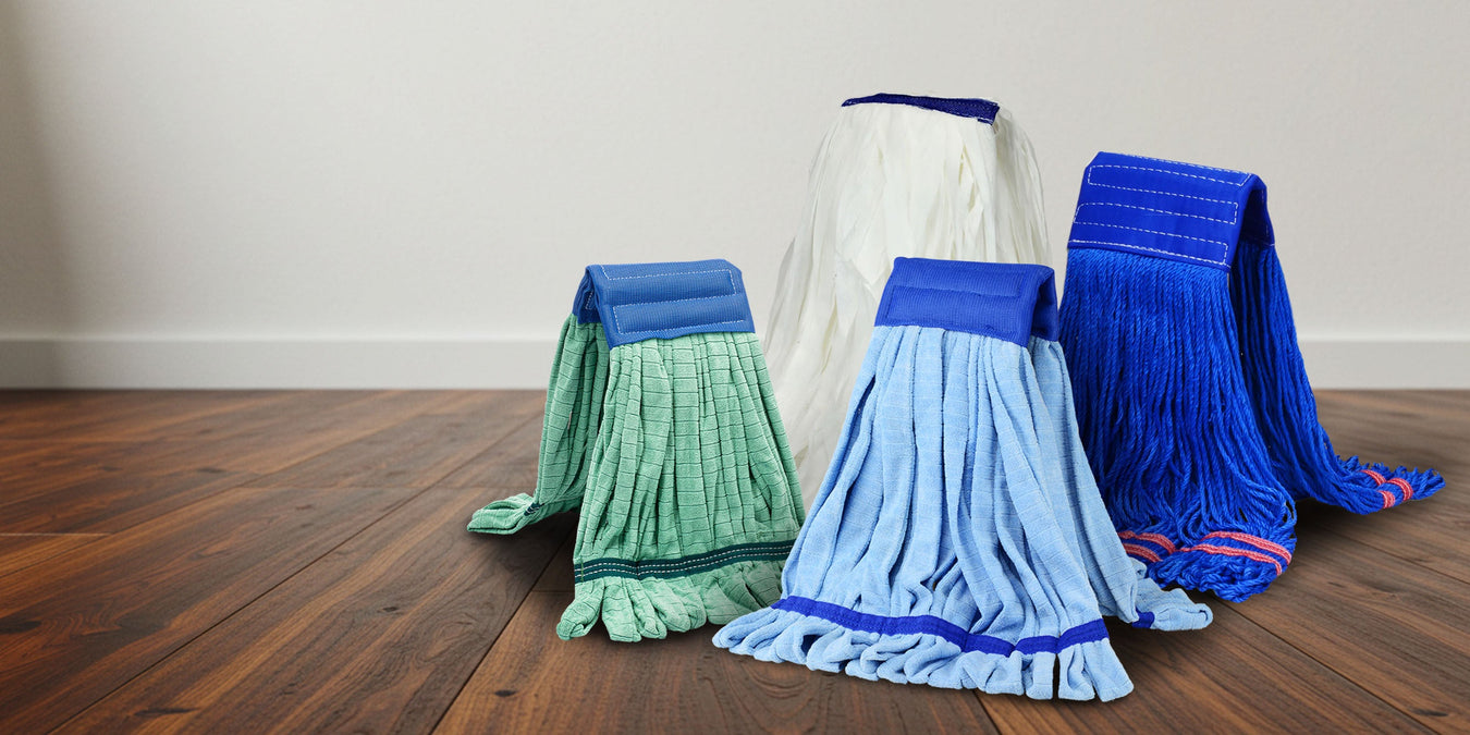 collection of wet mops on a hardwood flor
