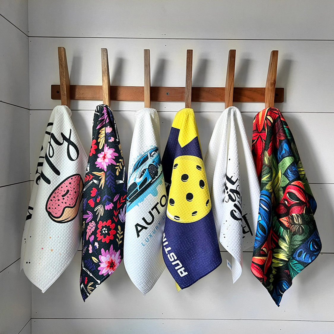 printed waffle weave towels hanging on hooks