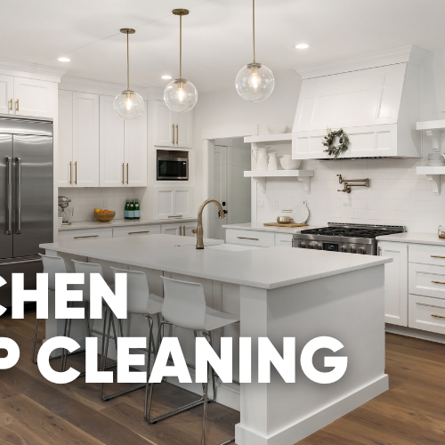 Modern kitchen interior with white cabinets and island, promoting deep cleaning.