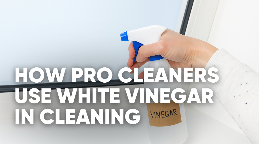 Hand holding a spray bottle, text about using vinegar for cleaning.