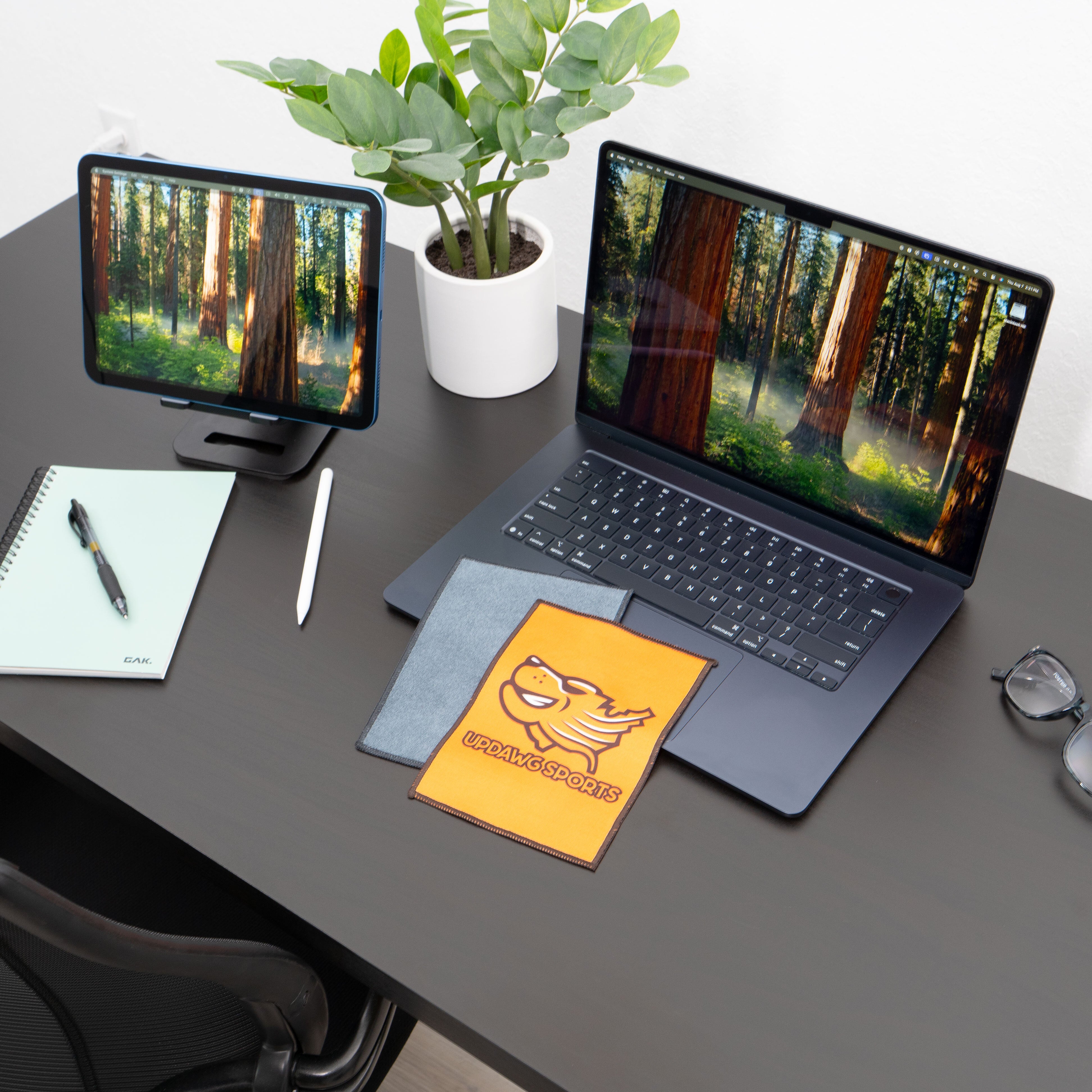 microfiber lens cloth on a desk and laptop