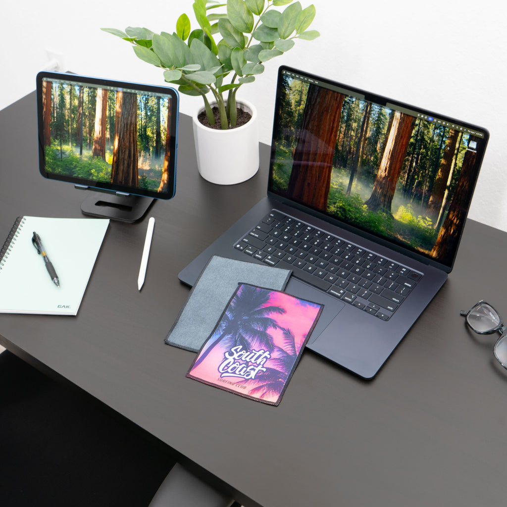 microfiber lens cloth on a desk and laptop