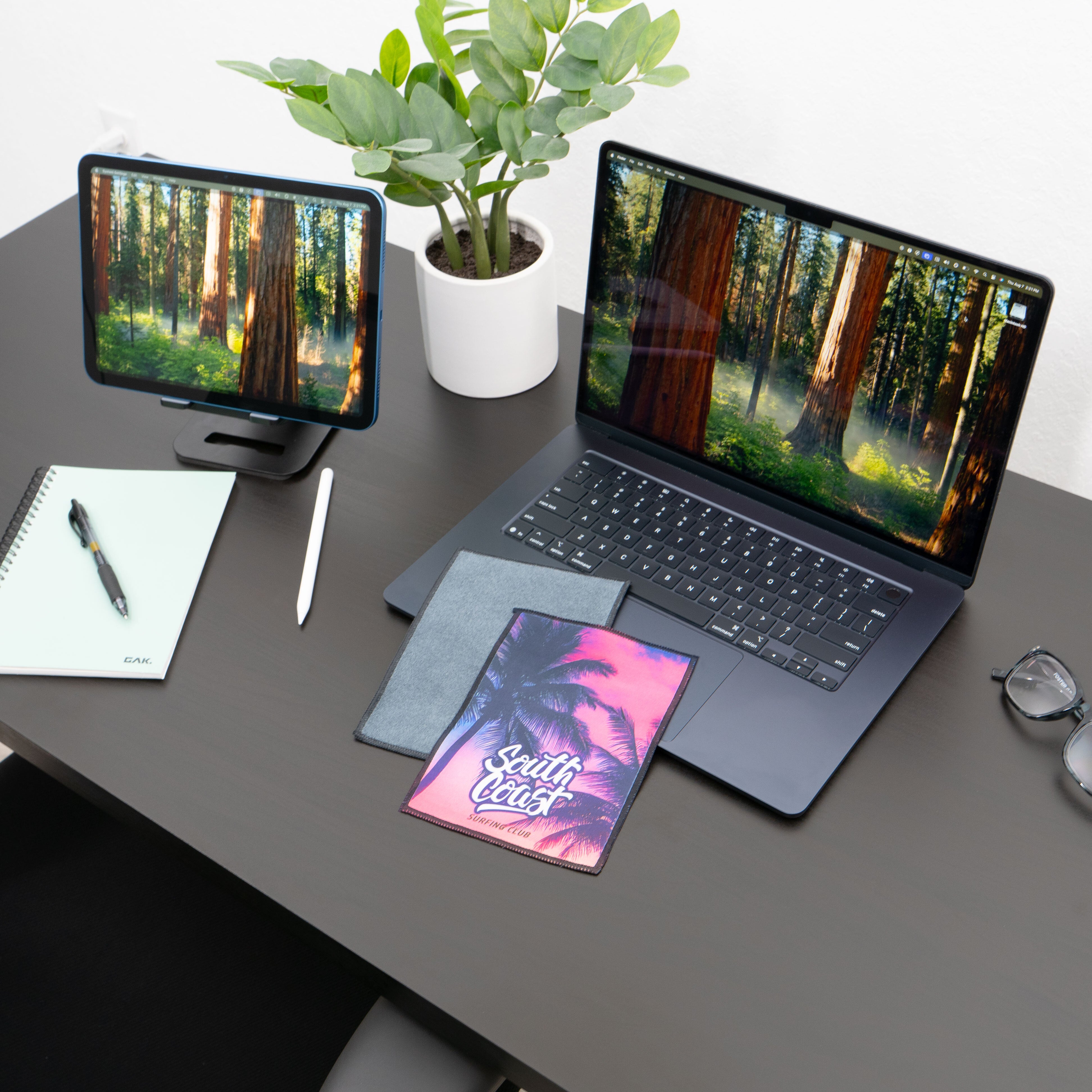 microfiber lens cloth on a desk and laptop