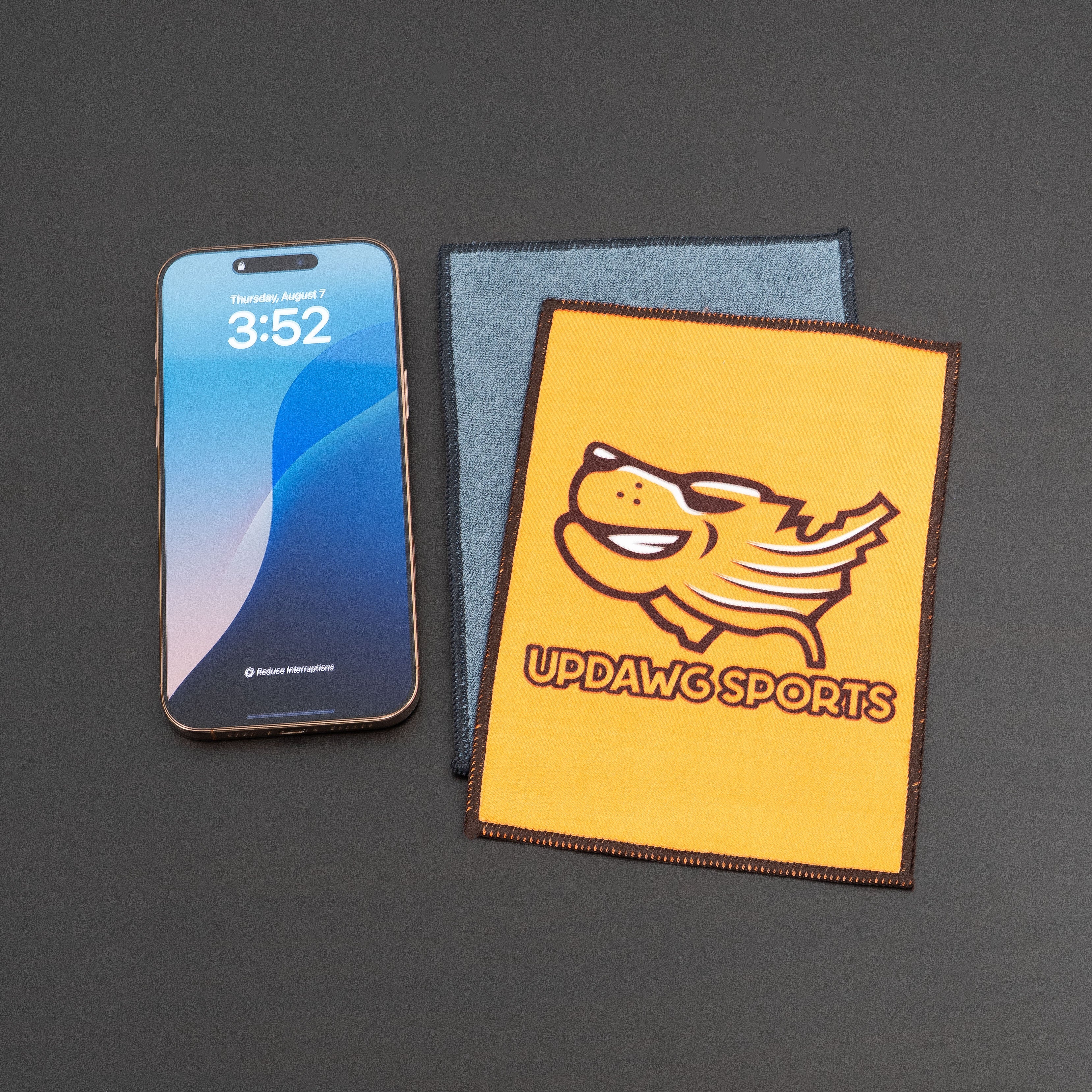 microfiber lens cloth on a desk and iphone