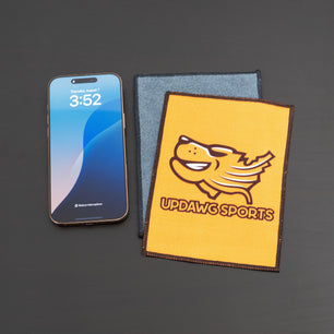 microfiber lens cloth on a desk and iphone