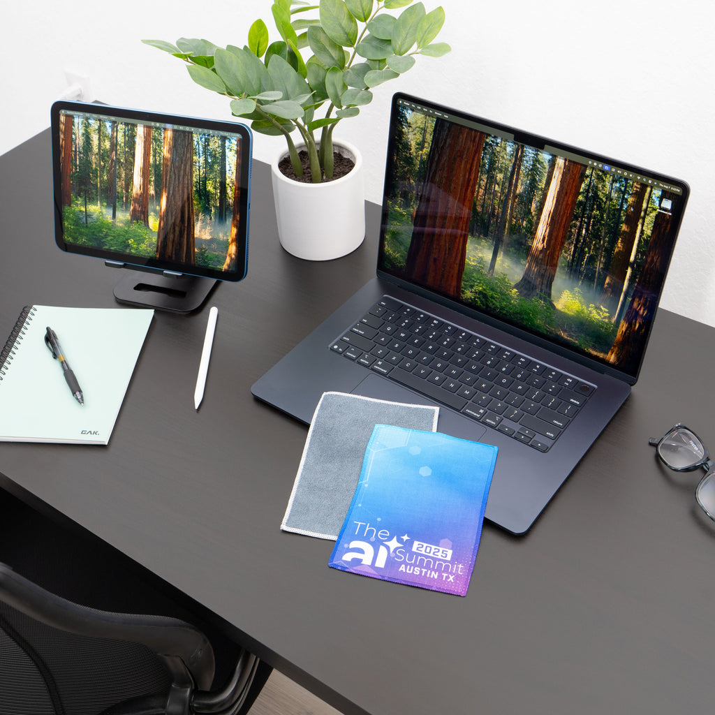 microfiber lens cloth on a desk and laptop