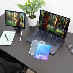 microfiber lens cloth on a desk and laptop