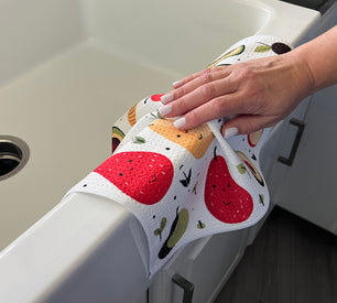 a lady cleaning with a printed waffle towel