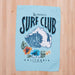 surf club printed waffle towel on a wooden countertop