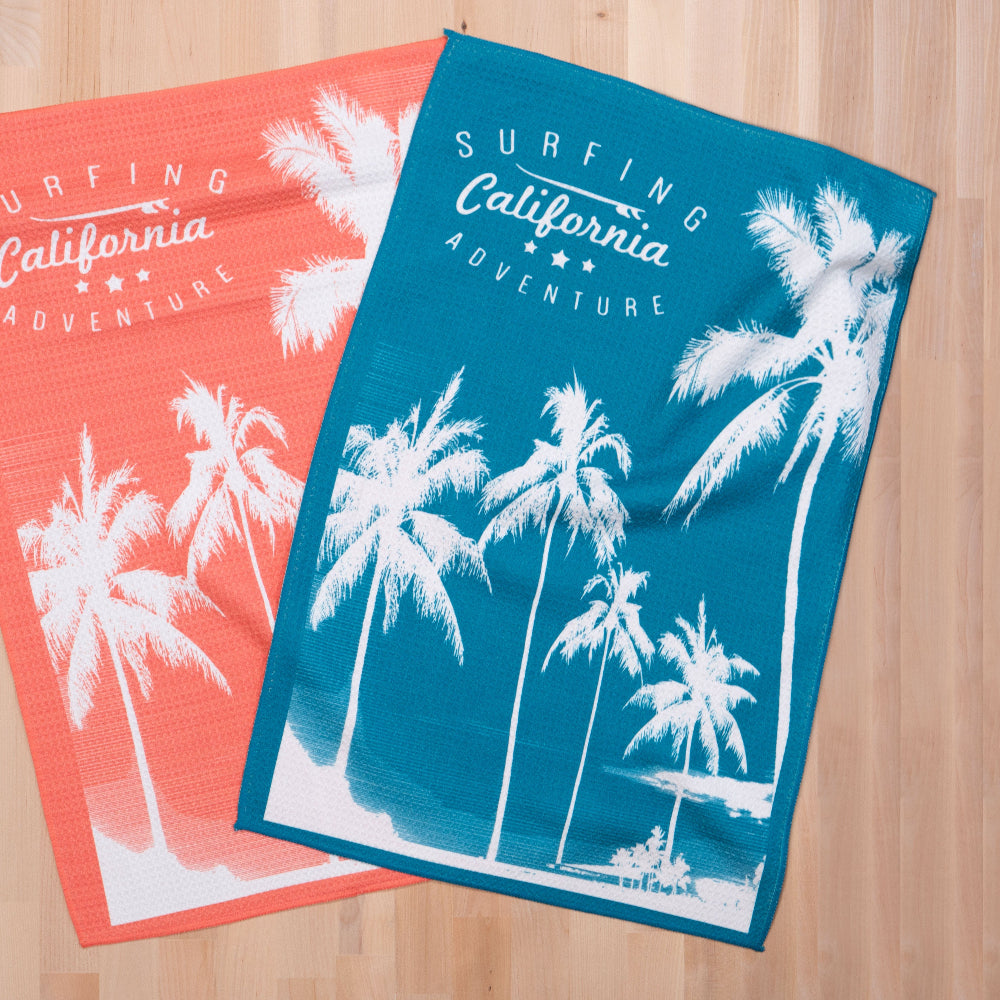 surfing california printed waffle towel on a wooden countertop
