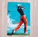 golf printed waffle towel on a wooden countertop