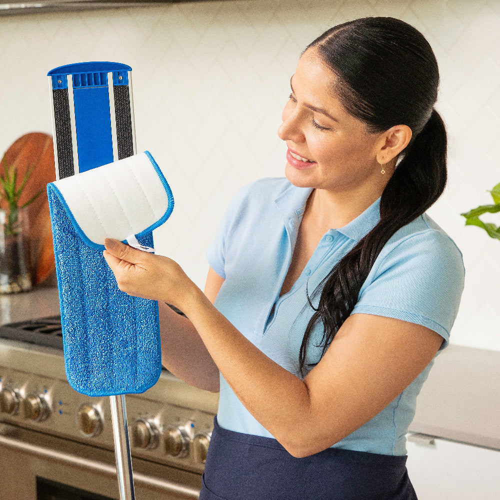 cleaner removing a microfiber mop pad off a mop frame