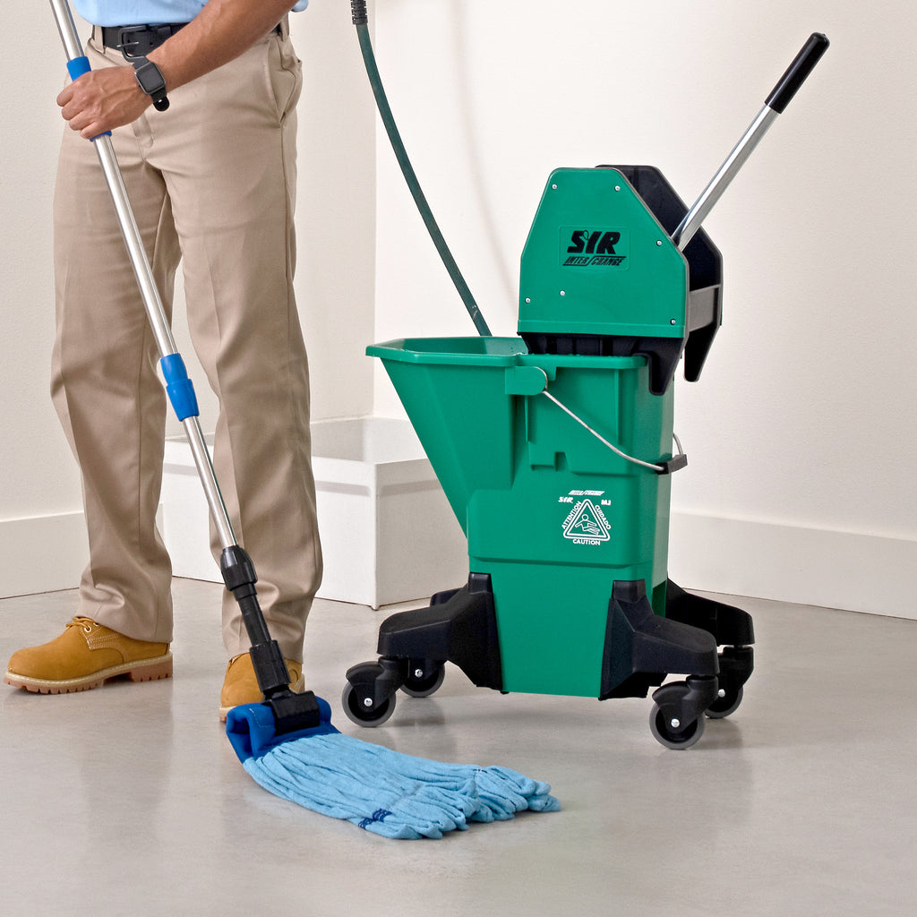 man mopping concrete with a blue microfiber tube mop and green bucket